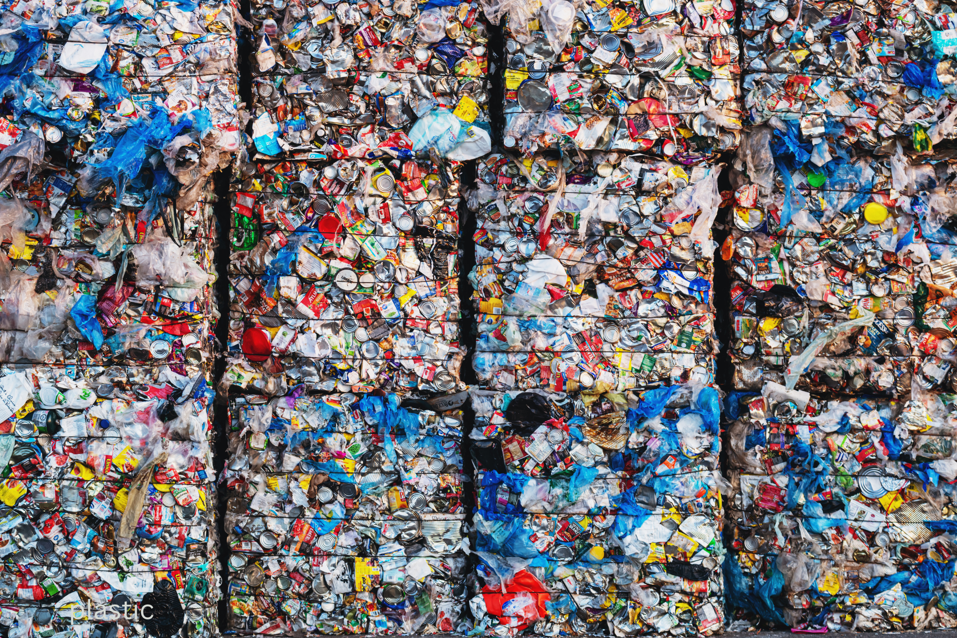 Baled compressed plastic — scale of waste volumes versus recycling throughput